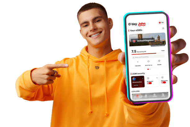 Ozly traveller holding up the Ozly eSIM app